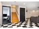 Finished basement features a checkerboard floor and stair access to another level at 267 Bald Eagle Dr, Pittsboro, NC 27312