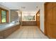 Bright primary bathroom with double vanity, soaking tub, and a glass-enclosed shower at 267 Bald Eagle Dr, Pittsboro, NC 27312