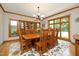 Formal dining room with hardwood floors, large windows, and stylish chandelier at 267 Bald Eagle Dr, Pittsboro, NC 27312