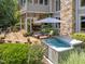 Expansive deck with hot tub, seating, and dining area, seamlessly blending with the lush, green backyard at 267 Bald Eagle Dr, Pittsboro, NC 27312