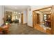 Open-concept living room with stone fireplace, hardwood floors, and elegant dining area at 267 Bald Eagle Dr, Pittsboro, NC 27312