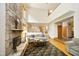 Bright, open living room features a stone fireplace, hardwood floors, and comfortable seating at 267 Bald Eagle Dr, Pittsboro, NC 27312