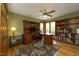 Spacious office features built-in shelves and cabinets, a ceiling fan, and a large desk at 267 Bald Eagle Dr, Pittsboro, NC 27312
