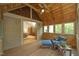 Screened-in porch overlooking the property with a wooden vaulted ceiling at 267 Bald Eagle Dr, Pittsboro, NC 27312