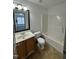 The bathroom is equipped with a tub and shower, plus a vanity with good lighting at 2907 S S Roxboro St, Durham, NC 27707