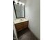 Small bathroom showcasing a functional vanity and a well-lit mirror at 2907 S S Roxboro St, Durham, NC 27707