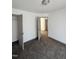Bedroom featuring plush carpet with standard closet and neutral paint at 2907 S S Roxboro St, Durham, NC 27707
