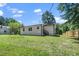 The backyard is large and grassy with a wooden privacy fence at 311 Troy St, Creedmoor, NC 27522