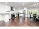 Modern kitchen with white cabinetry, stainless steel appliances, and granite countertops at 311 Troy St, Creedmoor, NC 27522