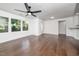 Bright living room with hardwood floors, access to back deck, and lots of natural light at 311 Troy St, Creedmoor, NC 27522