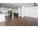 Spacious, open-concept living space with modern finishes, hardwood floors and stainless appliances at 311 Troy St, Creedmoor, NC 27522