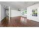 Spacious living room with hardwood floors, ceiling fan, and lots of natural light at 311 Troy St, Creedmoor, NC 27522