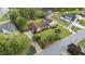 Expansive aerial view shows a home with a well-manicured lawn, mature trees, and a long driveway at 315 Crescent Dr, Clayton, NC 27520