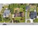 An aerial view displays the home's expansive lot with lush landscaping and well-manicured lawns at 315 Crescent Dr, Clayton, NC 27520