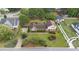 Well-manicured lawn and mature trees adorn this home, as seen from an elevated aerial perspective at 315 Crescent Dr, Clayton, NC 27520