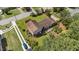 Aerial view highlighting the home’s mature trees, landscaping and long driveway at 315 Crescent Dr, Clayton, NC 27520