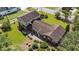 Aerial shot of a well manicured lot with lovely trees surrounding a brick home at 315 Crescent Dr, Clayton, NC 27520