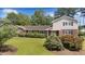 Attractive home features a combination of brick and siding, complemented by verdant landscaping and a well-kept lawn at 315 Crescent Dr, Clayton, NC 27520