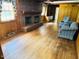 Comfortable living room showcasing a fireplace, hardwood floors, and cozy furniture at 315 Crescent Dr, Clayton, NC 27520