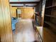 Cozy living room with hardwood floors, fireplace and wood paneled walls at 315 Crescent Dr, Clayton, NC 27520