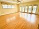 Bright living room featuring hardwood floors and large windows providing natural light at 315 Crescent Dr, Clayton, NC 27520