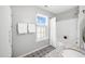 Updated bathroom featuring decorative tile floors, granite countertop, tub, and stylish fixtures at 3201 Sawyers Mill Dr, Apex, NC 27539