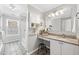 This bathroom offers tile flooring, a vanity with a granite countertop, and built-in storage at 3201 Sawyers Mill Dr, Apex, NC 27539
