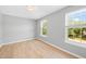 Well-lit bedroom with wood floors and large windows at 3201 Sawyers Mill Dr, Apex, NC 27539