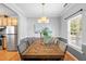 Comfortable dining room with a modern chandelier and a view into the kitchen space at 3201 Sawyers Mill Dr, Apex, NC 27539