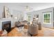 Inviting living room boasts a fireplace, comfortable seating, and plenty of natural light at 3201 Sawyers Mill Dr, Apex, NC 27539