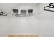 This walk-in closet features white wire shelving, black baskets, and plenty of space to hang and store clothing at 3201 Sawyers Mill Dr, Apex, NC 27539