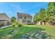 Sprawling backyard with lush green grass, mature trees, and an exterior shed at 3212 Marblewood Ct, Raleigh, NC 27604