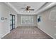 Bedroom with carpet, ceiling fan, and three large windows for ample natural light at 3212 Marblewood Ct, Raleigh, NC 27604