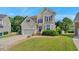 Attractive two-story home featuring brick steps, attached garage, neutral siding, and landscaped front lawn at 3212 Marblewood Ct, Raleigh, NC 27604