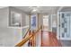Hallway with hardwood floors and multiple entryways, showing an open and accessible layout at 3212 Marblewood Ct, Raleigh, NC 27604