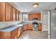 Functional kitchen featuring stainless steel appliances, neutral countertops and ample cabinet space at 3212 Marblewood Ct, Raleigh, NC 27604