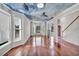 Spacious living area boasting wood floors, bay windows, and a unique custom ceiling mural design at 3212 Marblewood Ct, Raleigh, NC 27604