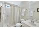 Bathroom featuring a shower, tile flooring, a sink vanity, a mirror, and towel bars, with neutral colors at 325 Millet Dr, Morrisville, NC 27560