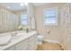 Bathroom with a single vanity, tile flooring, and neutral paint colors, along with a window and towel bar at 325 Millet Dr, Morrisville, NC 27560