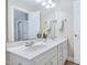 Bathroom featuring a double vanity sink, tile flooring, a large mirror, and towel bars, and neutral paint at 325 Millet Dr, Morrisville, NC 27560