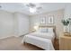 Comfortable bedroom with neutral colors, soft carpet, closet, and a bedside table, creating a tranquil and inviting atmosphere at 325 Millet Dr, Morrisville, NC 27560
