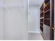 Walk-in closet with custom shelving, rods and drawers, ideal for organization, and with convenient accessibility at 325 Millet Dr, Morrisville, NC 27560