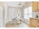Cozy breakfast nook featuring a round table with two chairs, a ceiling fan, and a window providing natural light at 325 Millet Dr, Morrisville, NC 27560