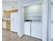 Convenient laundry closet with washer and dryer next to kitchen, ensuring easy access for daily chores at 325 Millet Dr, Morrisville, NC 27560