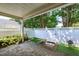 Charming private patio with brick pavers and a white fence, perfect for outdoor relaxation and entertaining at 325 Millet Dr, Morrisville, NC 27560