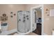 This bathroom features a glass shower and painted beige walls at 401 N Main St, Louisburg, NC 27549