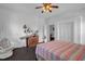 Bright bedroom featuring a decorative fireplace and closet for storage at 401 N Main St, Louisburg, NC 27549