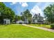 Charming home with a well-kept lawn and a detached garage at 401 N Main St, Louisburg, NC 27549