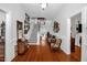 Inviting foyer featuring hardwood floors, staircase, and elegant decor, creating a grand entrance at 401 N Main St, Louisburg, NC 27549