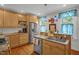 Well-lit kitchen features granite countertops, stainless steel appliances, and lovely blue decorative accents at 401 N Main St, Louisburg, NC 27549